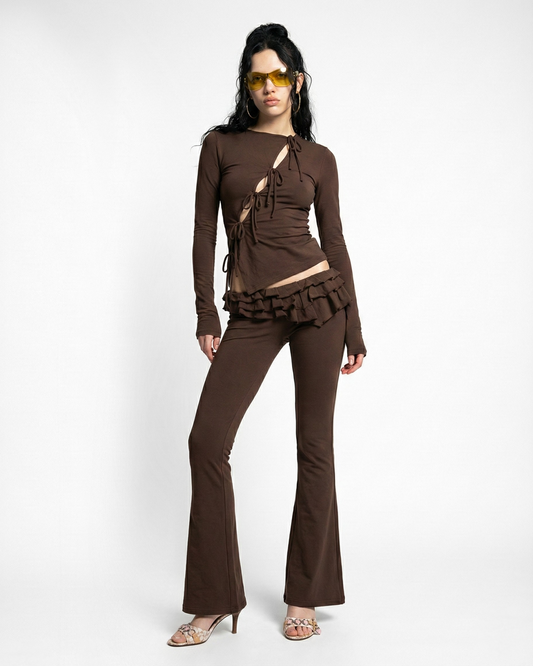 BOOT CUT LOW RISE PANTS WITH ASYMETRIC RUFFLE DETAILS